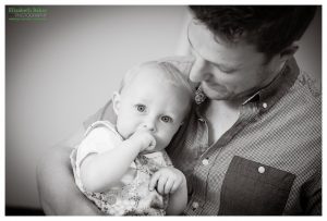 dad and baby cuddle