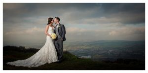 landscape photo with sky and newlyweds