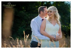 bride and groom in field