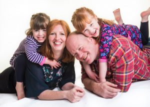 dad getting squashed by twin girls