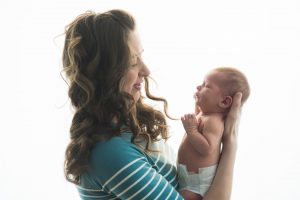 mum holds newborn baby