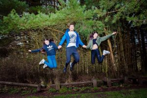 brother and sisters flying jump capture