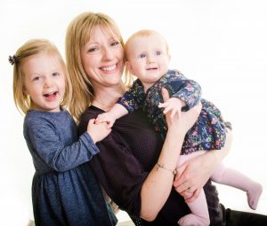mum and children smiling and cuddling