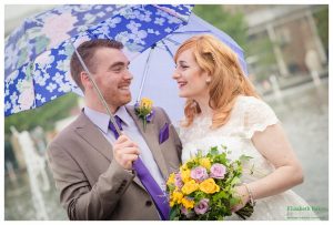 raining umbrella couple