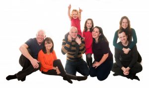 studio photo of family sitting