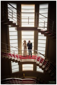 geometric window light staircase image bride and dad