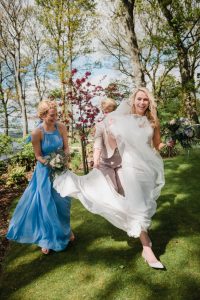 bride and helpers in the wind