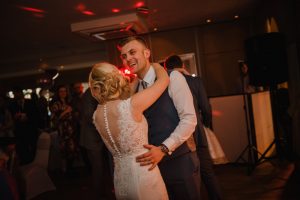 bride and groom laughing during the first dance