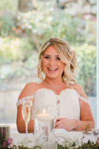 close up of bride laughing during the speeches