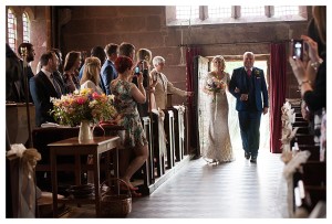 bride and dad walking into the church