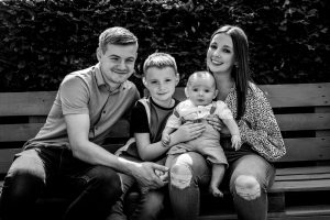 black and white photo of a young family portrait