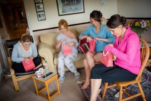 bridesmaids open their presents