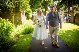 bride and groom leave church