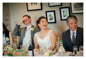 bride laughing during speeches