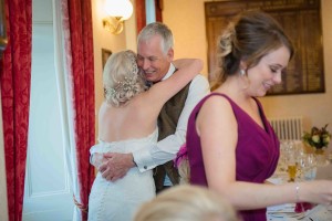 bride hugs her dad after speeches