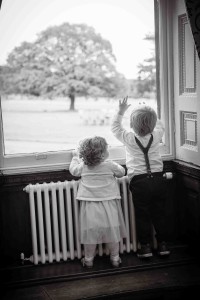black and white photo of children at window
