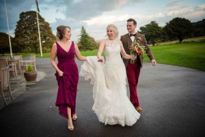 walking and laughing with bridesmaid
