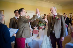 groom and dad high five