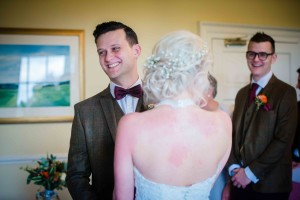 couple share a laugh during the ceremony