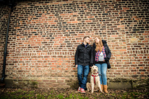 dog posing husband and wife looking at each other