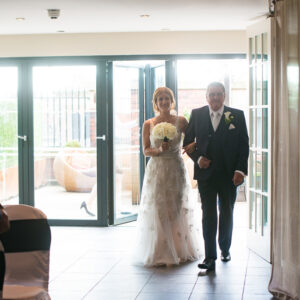 bride arrives at ceremony aisle