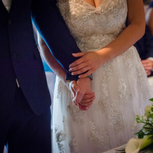 holding hands during marriage ceremony