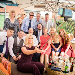 selfie stick group photo of guests