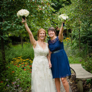 bridesmaid and bride with bouquets