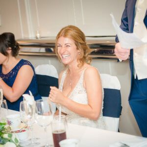 bride laughing during speeches