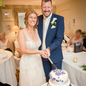 couple cuts cake