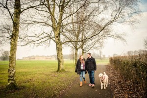 walking in foggy park with dog