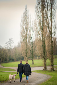 walking away from camera couple and dog