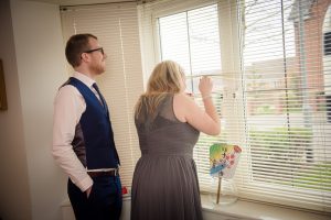bridesmaid peeping at bridal bus
