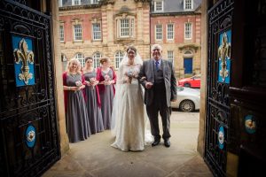 in doorway, bride and dad