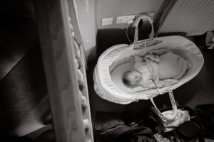 baby sleeping in moses basket