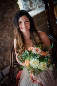bride holding flowers looking at camera