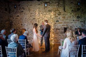 barn wedding couple during ceremony