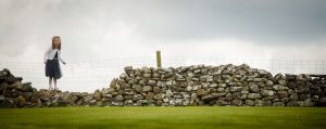 little girl playing on wall at Knipe hall