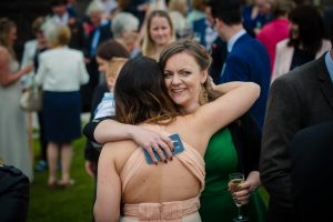 wedding guest congratulate holding phone camera