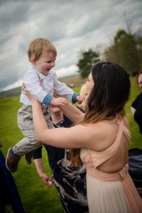 bride plays with son