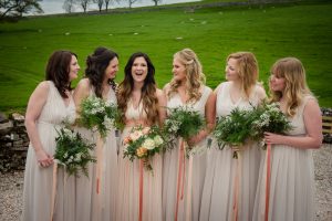 bridesmaids having fun with bride