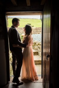newlyweds in doorway before wedding breakfast