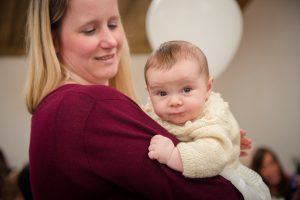baby and mum hugging