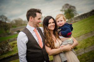 photo of bride groom and baby
