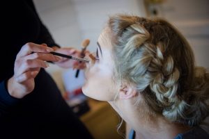 bridesmaid finishing touches to makeup