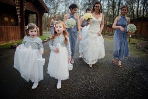 flower girls lead the way to the ceremony