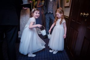 flower girls bridesmaids playing before ceremony