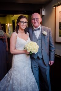 bride and dad waiting to go in