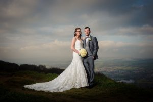 landscape view with stormy skies and newlyweds