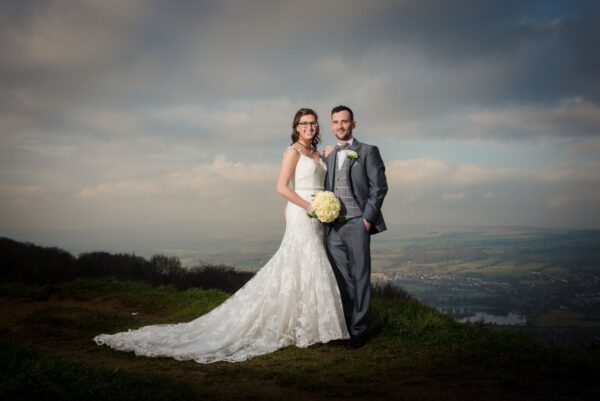 landscape view with stormy skies and newlyweds